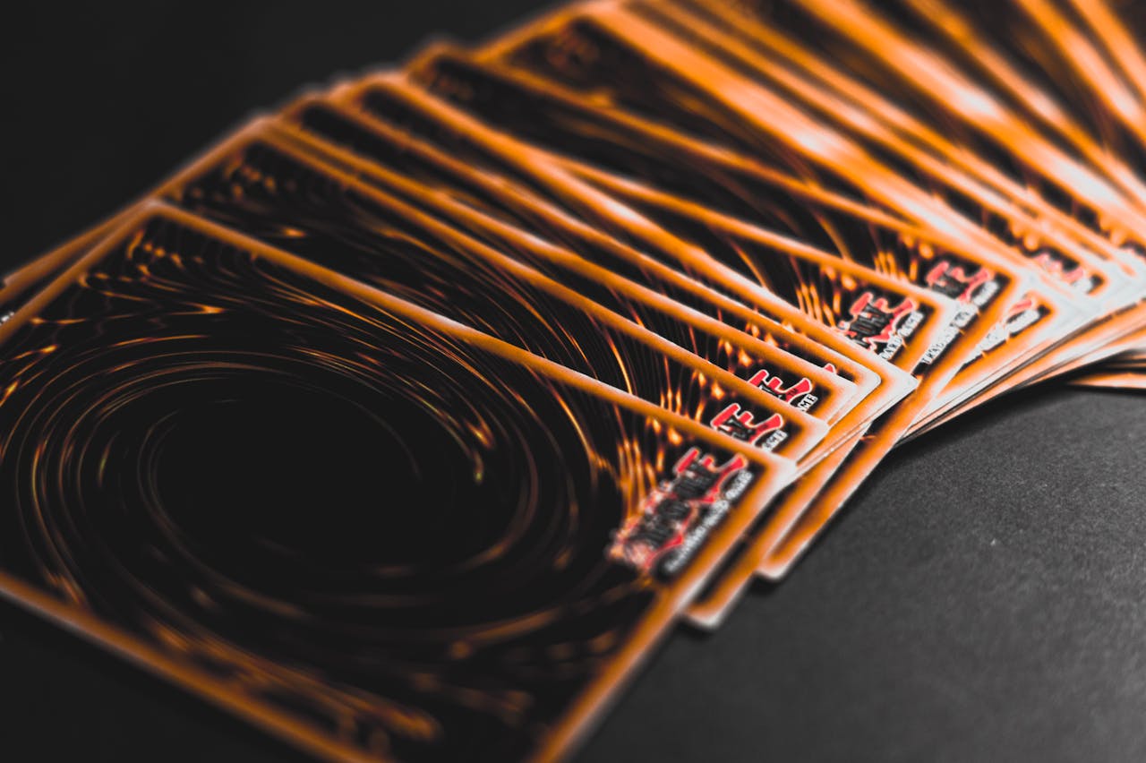 Close-up view of collectible trading cards in a fan arrangement, highlighting intricate patterns.